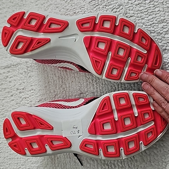 NWOT Nike Revolution's in Black and, fluorescent pink.  Never worn!  Size 7.5 - Picture 2 of 4